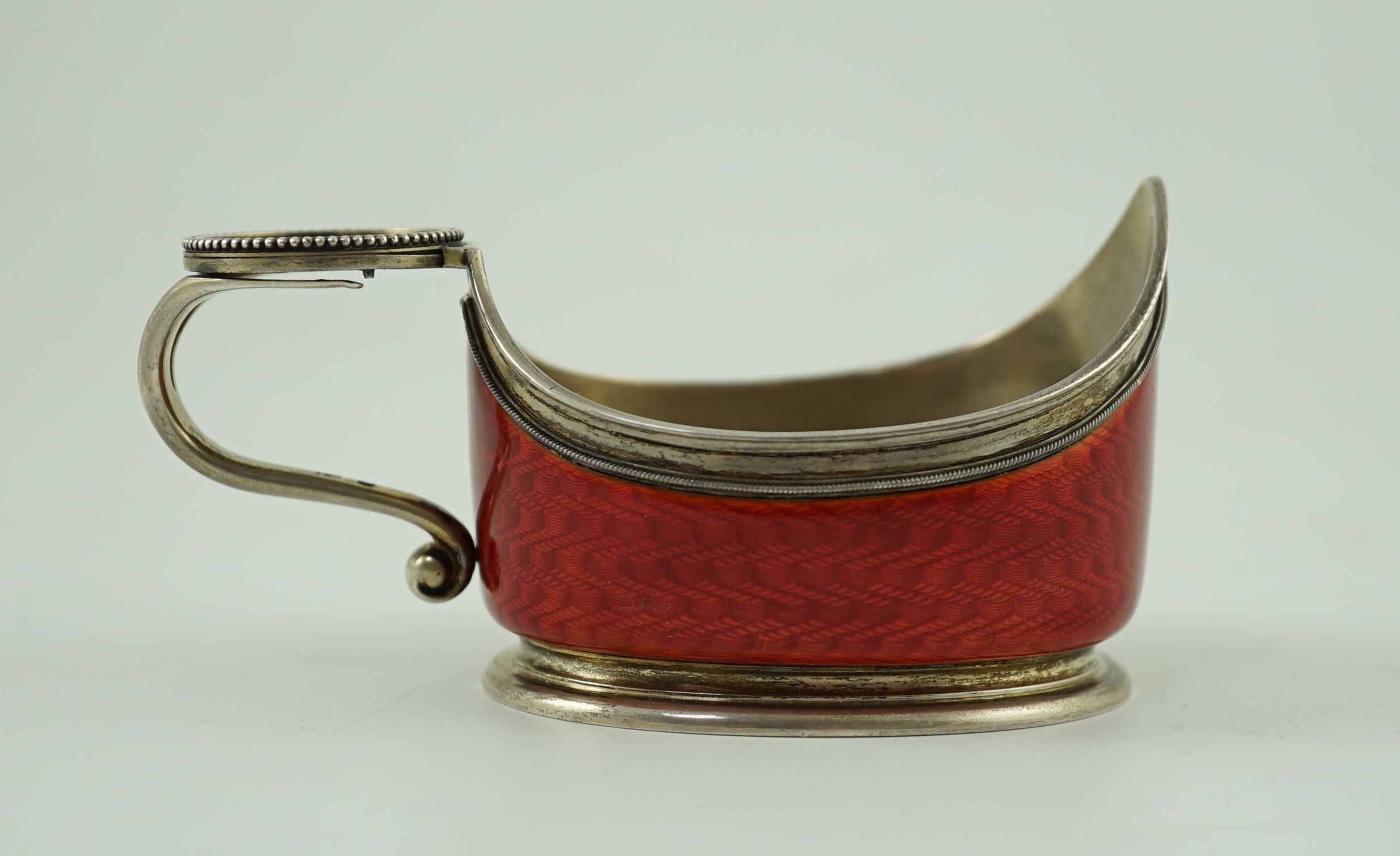 CARL FABERGE: A late 19th/early 20th century 88 zolotnik and red guilloche enamel oval kovsh, work master Anders Johan Nevalainen